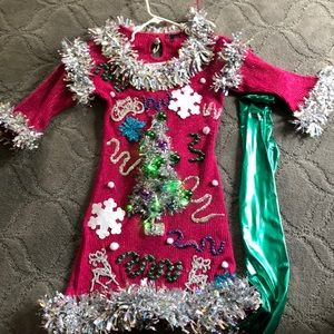Ugly Xmas light up  dress w/ green leggings.